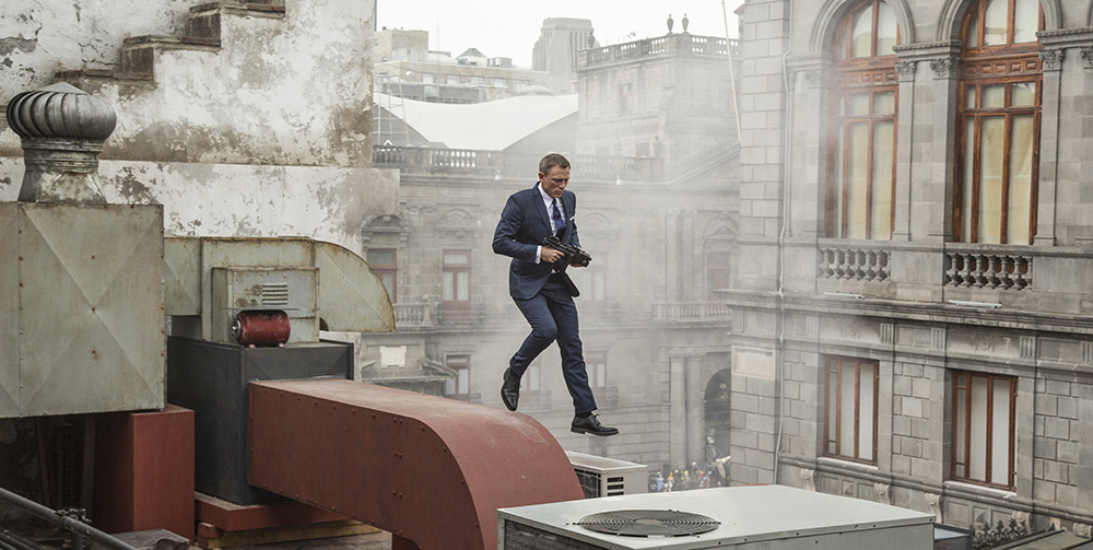 Bond (Daniel Craig) runs along the rooftops in pursuit of Sciarra in Mexico City in Metro-Goldwyn-Mayer Pictures/Columbia Pictures/EON Productions™ action adventure SPECTRE.